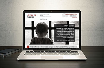 Picture of Ressler & Tesh law firm website on laptop computer