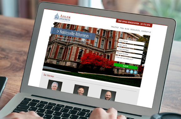 Laptop view of Adler Attorneys website