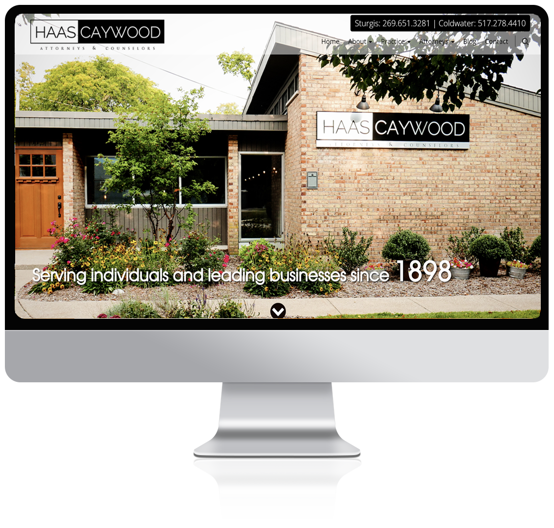 Haas Caywood home page being displayed on a computer monitor