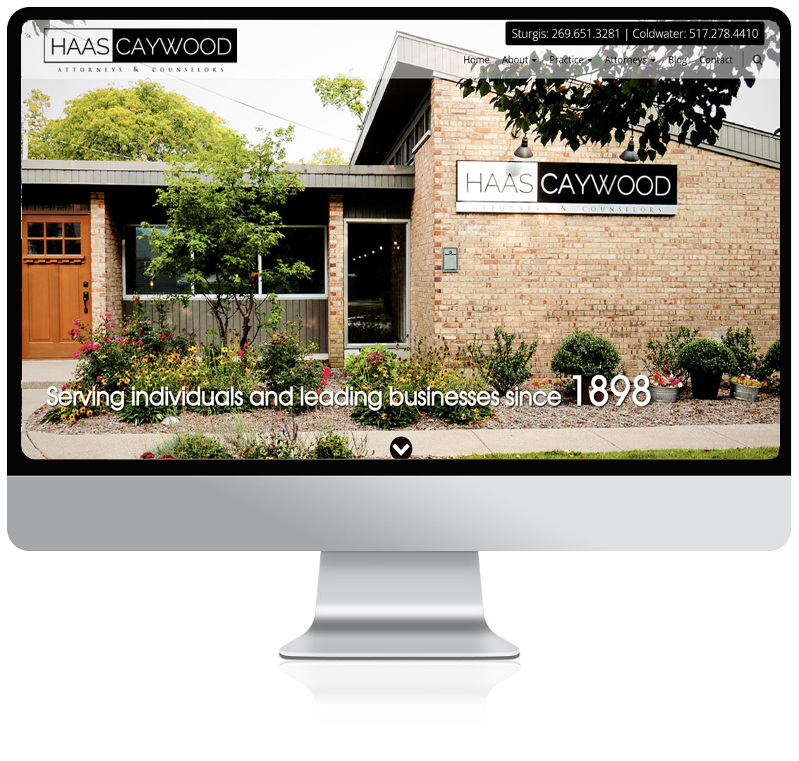 Haas Caywood home page being displayed on a computer monitor