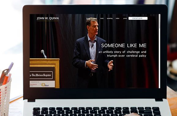 Laptop image of John Quinn website