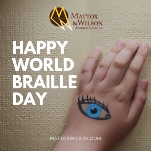 hand with an eye on it symbolizing braille day